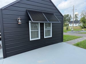 Bahama shutters installed on home exterior in Minnesota