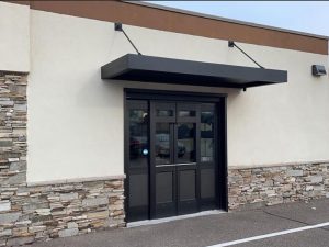 Durable metal canopy for exterior building protection in Minnesota