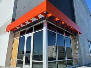 Metal canopy over building entrance for weather protection