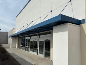 Storefront metal canopy installed in Minnesota