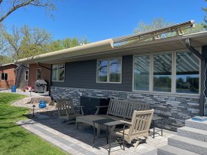 Custom retractable awning installation for outdoor living space in Twin Cities