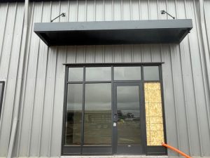 Metal canopy awning providing shade and weather protection in Minnesota