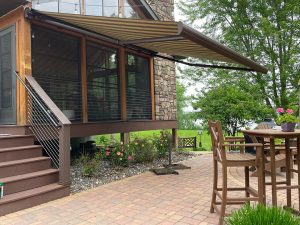 Sunbrella fabric retractable awning on modern Minnesota home