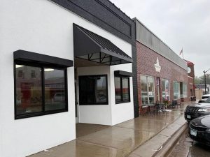 Commercial metal awning providing weather protection in the Twin Cities